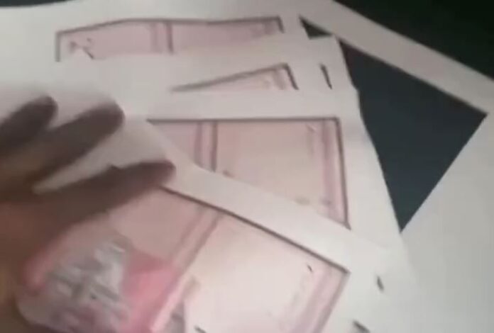 Video en redes muestra supuesto proceso casero de falsificación de billetes de RD$200