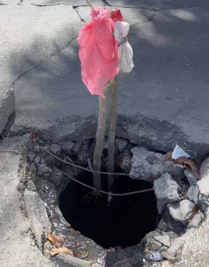 Comunitarios en Puerto Plata denuncian peligro por imbornales colapsados frente al CCR y exigen solución a las autoridades